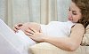 Woman laying and touching her stomach