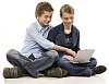 Teenagers sitting behind a computer