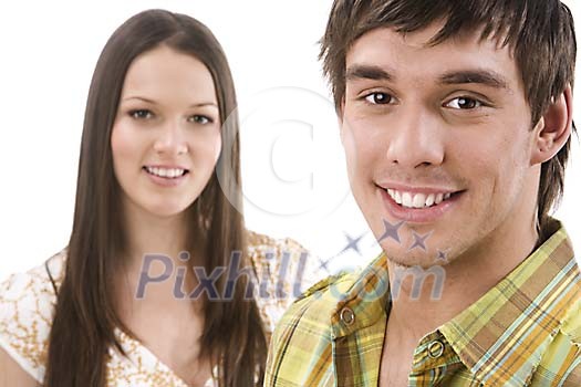 Couple of teenagers looking at the camera Couple of teenagers looking at the camera