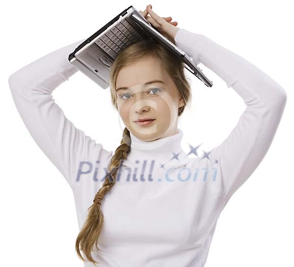 Girl standing , holding a laptop on her head