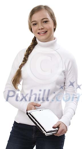 Teenage girl standing with a laptop Teenage girl standing with a laptop