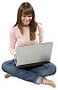 Isolated girl sitting on the floor with a laptop