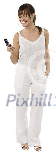 Isolated girl standing with a cell phone Isolated girl standing with a cell phone