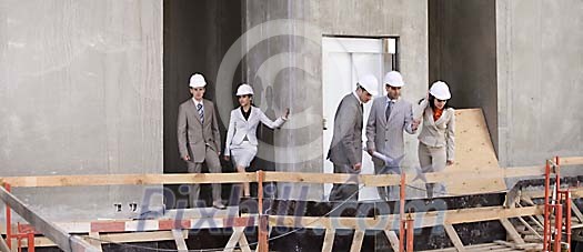 Group of people looking down from the construction site Group of people looking down from the construction site