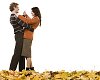 Couple dancing on the autumn leaves