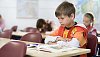 Young boy sitting in the classroom