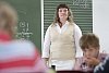 Female teacher standing in the classroom