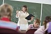 Female teacher standing in front of the class