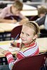 Young girl sitting in the classroom