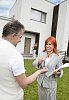 Man getting keys to the house from a woman