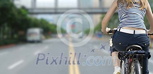 Woman biking in the city Woman biking in the city