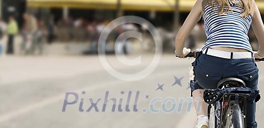 Woman biking on the street Woman biking on the street