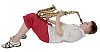 Isolated boy laying down, playing saxophone