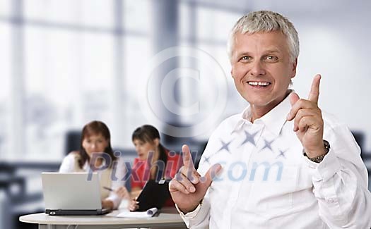 Happy male and two women in the office Happy male and two women in the office