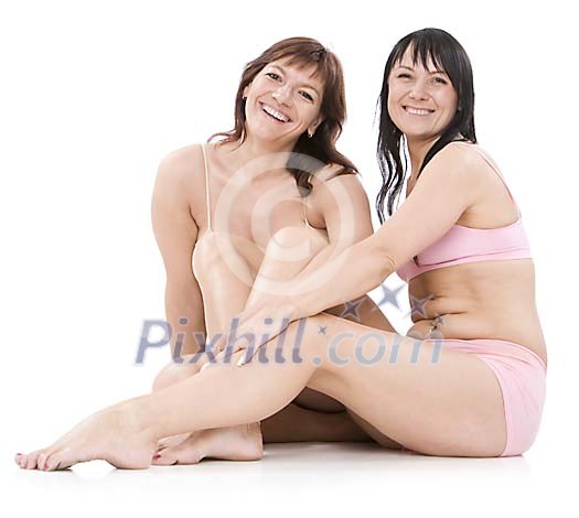 Isolated women sitting on the floor in their underwear Isolated women sitting on the floor in their underwear