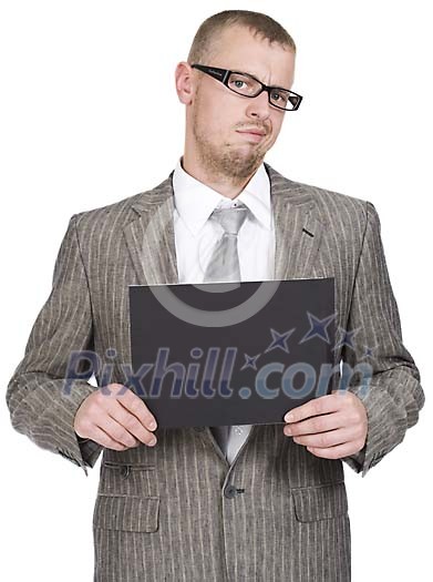 Businessman looking unhappy, holding a black paper Businessman looking unhappy, holding a black paper