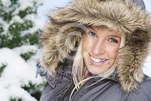 Woman in winter clothes smiling