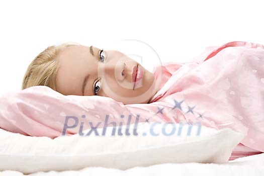 Woman in bed, waking up Woman in bed, waking up