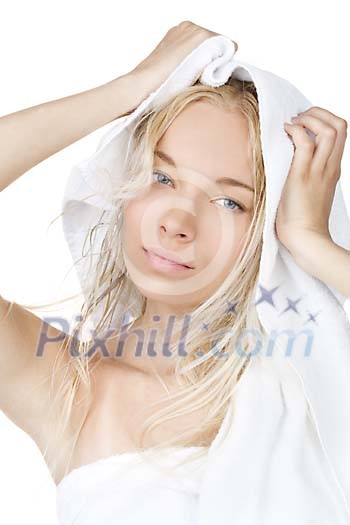 Woman drying her hair with a towel Woman drying her hair with a towel