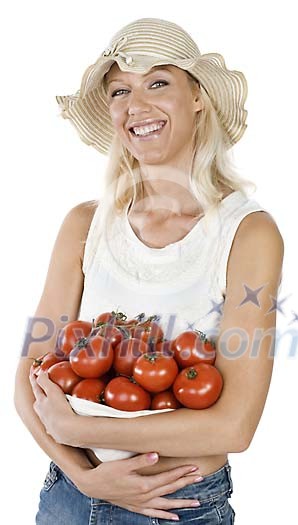 Isolated woman holding a pile of tomatoes in her arms Isolated woman holding a pile of tomatoes in her arms