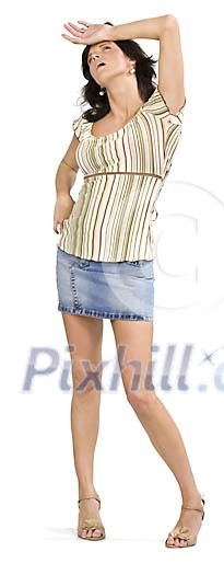 Isolated woman standing . holding a hand on her head