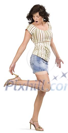 Isolated wiman standing and holding a shoe heel Isolated wiman standing and holding a shoe heel