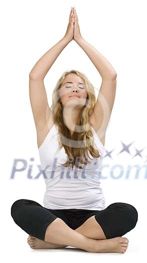 Isolated woman sitting on the floor meditating Isolated woman sitting on the floor meditating