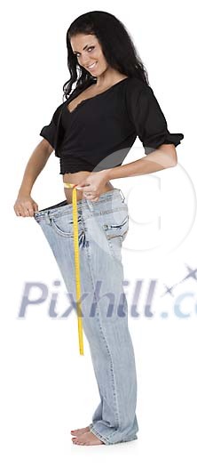 Isolated woman showing her loose pants Isolated woman showing her loose pants
