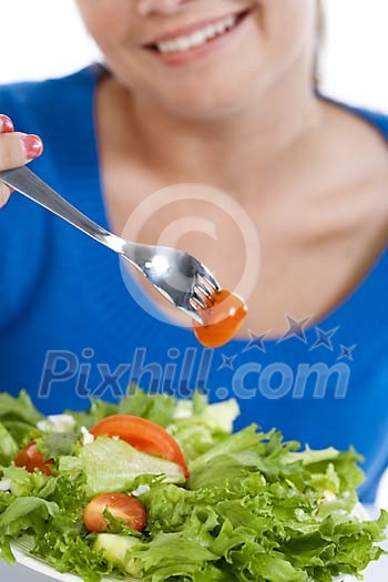 Woman eating a healthy salad Woman eating a healthy salad