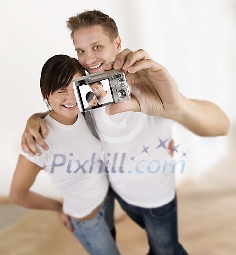 Couple taking a picture of themselves Couple taking a picture of themselves