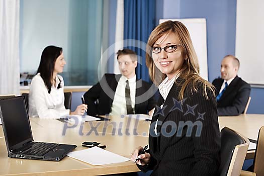 Women and men at a business meeting Women and men at a business meeting