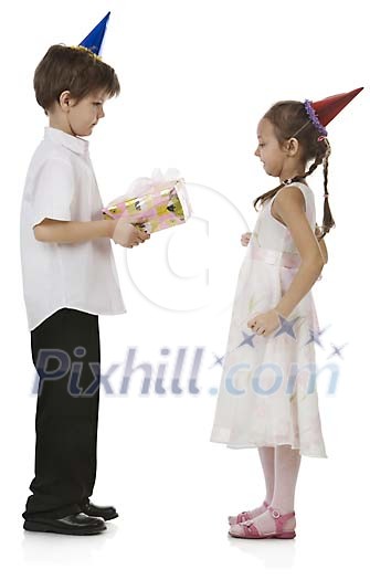 Boy giving a birthday gift to a girl Boy giving a birthday gift to a girl
