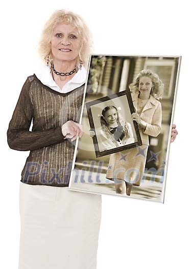 Older woman showing a photo of two her daughter and a granddaughter Older woman showing a photo of two her daughter and a granddaughter