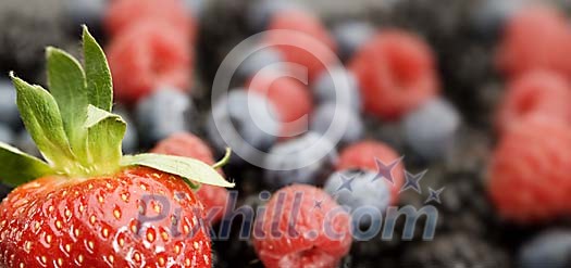 Background of strawberries, raspberries and blueberries