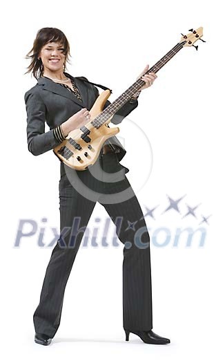 Isolated businesswoman playing a guitar Isolated businesswoman playing a guitar