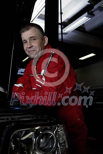 Male mechanic at the repair shop Male mechanic at the repair shop