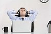 Businessman listening to music at his desk