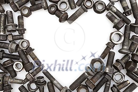 Heart shape in the middle of bolts and nuts Heart shape in the middle of bolts and nuts