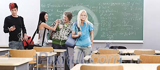 Teenagers coming in to the classroom Teenagers coming in to the classroom