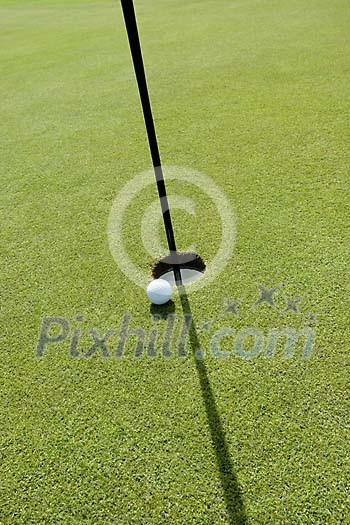 Golfball near the hole Golfball near the hole