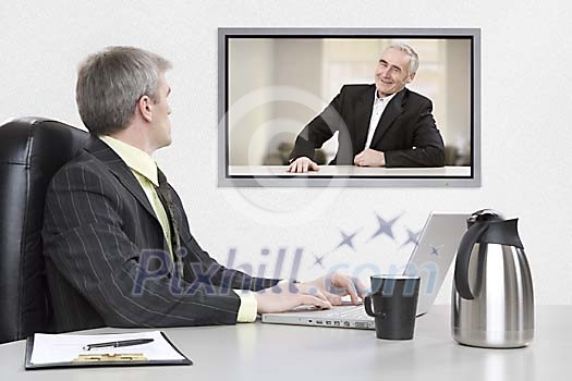 Businessmen having an online meeting Businessmen having an online meeting