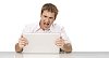 Isolated man looking mad about his laptop