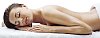 Beautiful woman lying  relaxed on towels