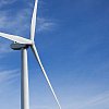 Close-up of a windmill against blue sky