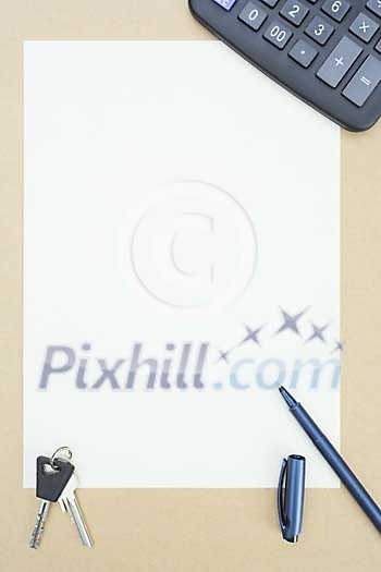 Empty paper surrounded with calculator, pen and keys Empty paper surrounded with calculator, pen and keys