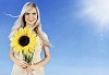 Beautiful girl holding a big sunflower