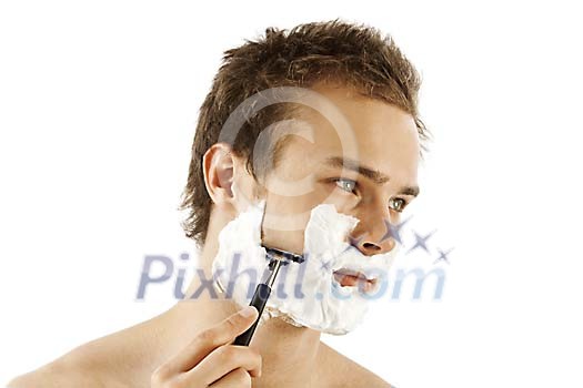 Man shaving with foam and razor Man shaving with foam and razor