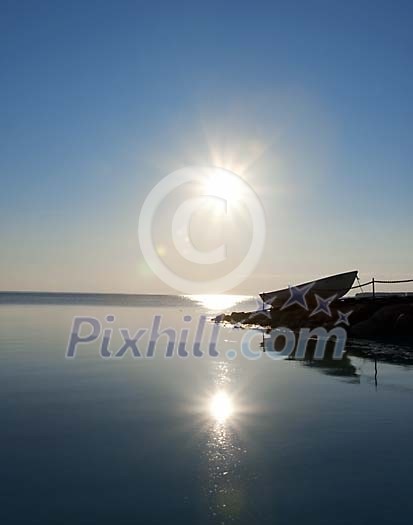 Rowing boat by the sea on summer morning Rowing boat by the sea on summer morning