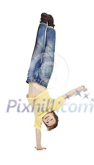 Young boy balancing with one hand Young boy balancing with one hand