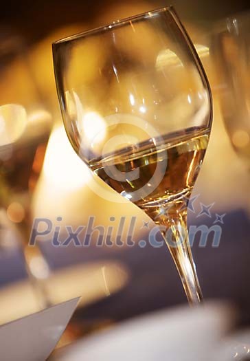 Glass of white wine half empty Glass of white wine half empty